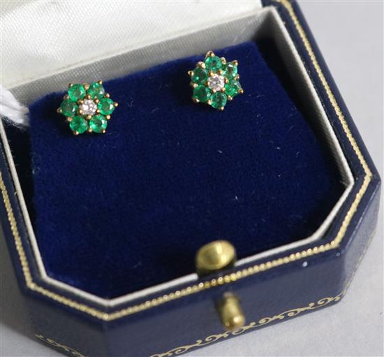 A pair of 9ct gold emerald and diamond ear studs
